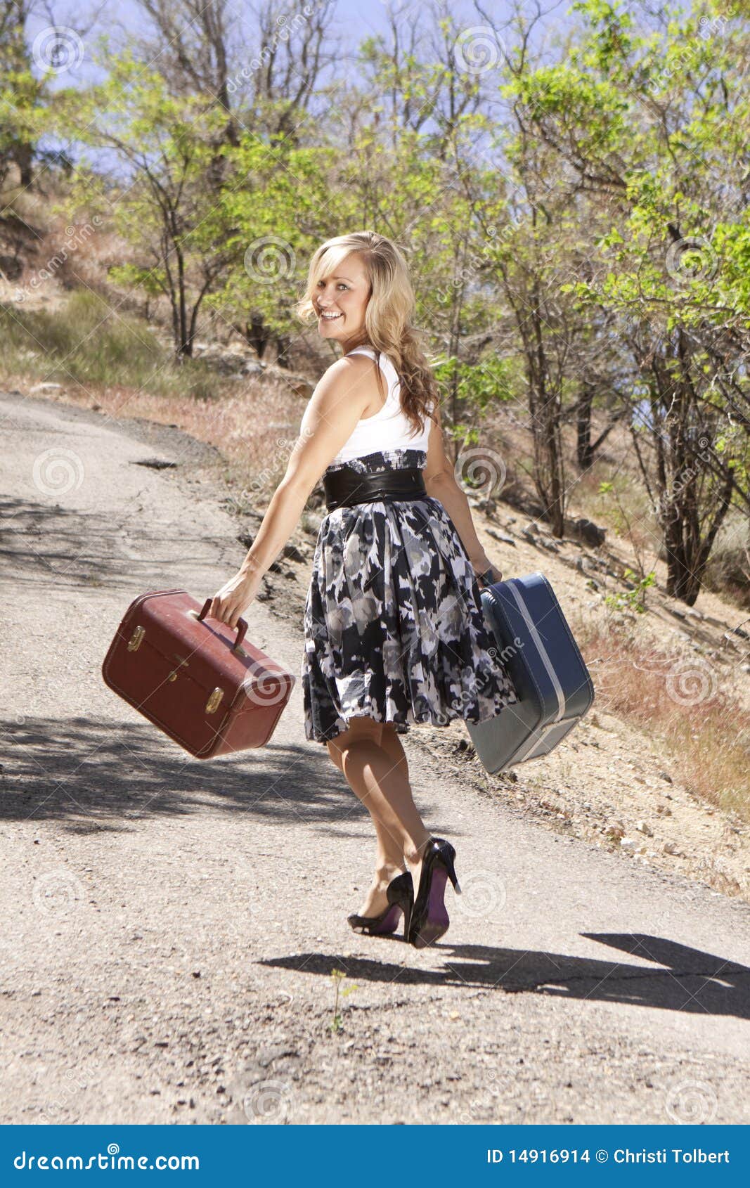 Girl Walking Down Path Looking Over Her Shoulder Stock 