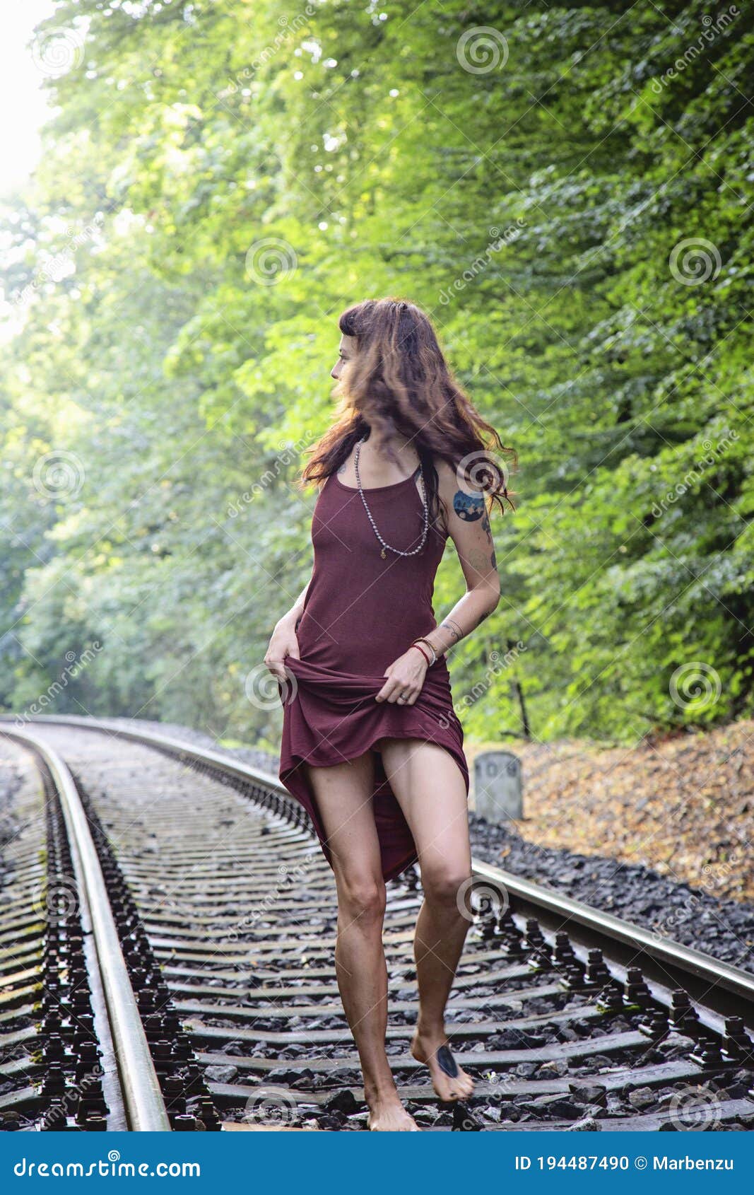 https://thumbs.dreamstime.com/z/girl-walking-empty-railway-forest-beautiful-194487490.jpg