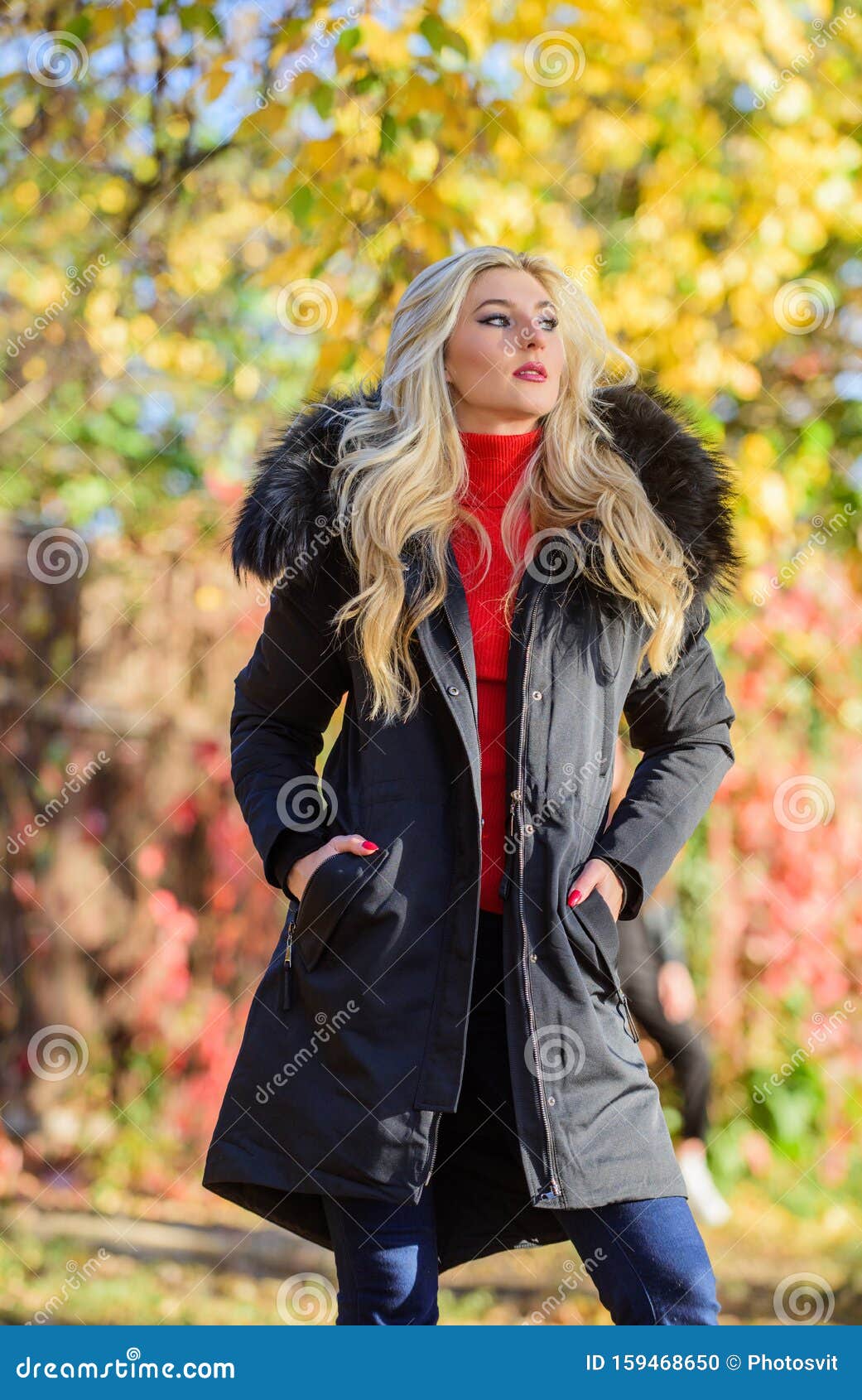 Girl in Warm Coat Stand in Park Nature Background Defocused. Create ...