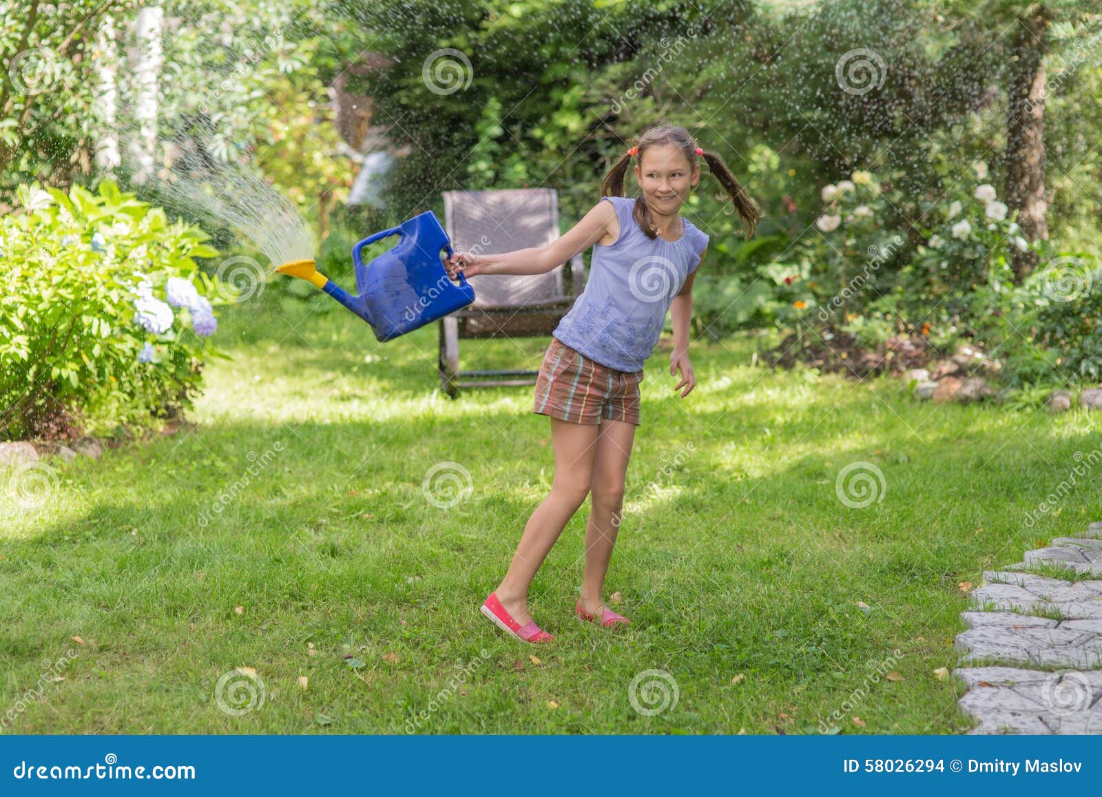 Girl with a watering can stock photo. Image of happiness 58026294