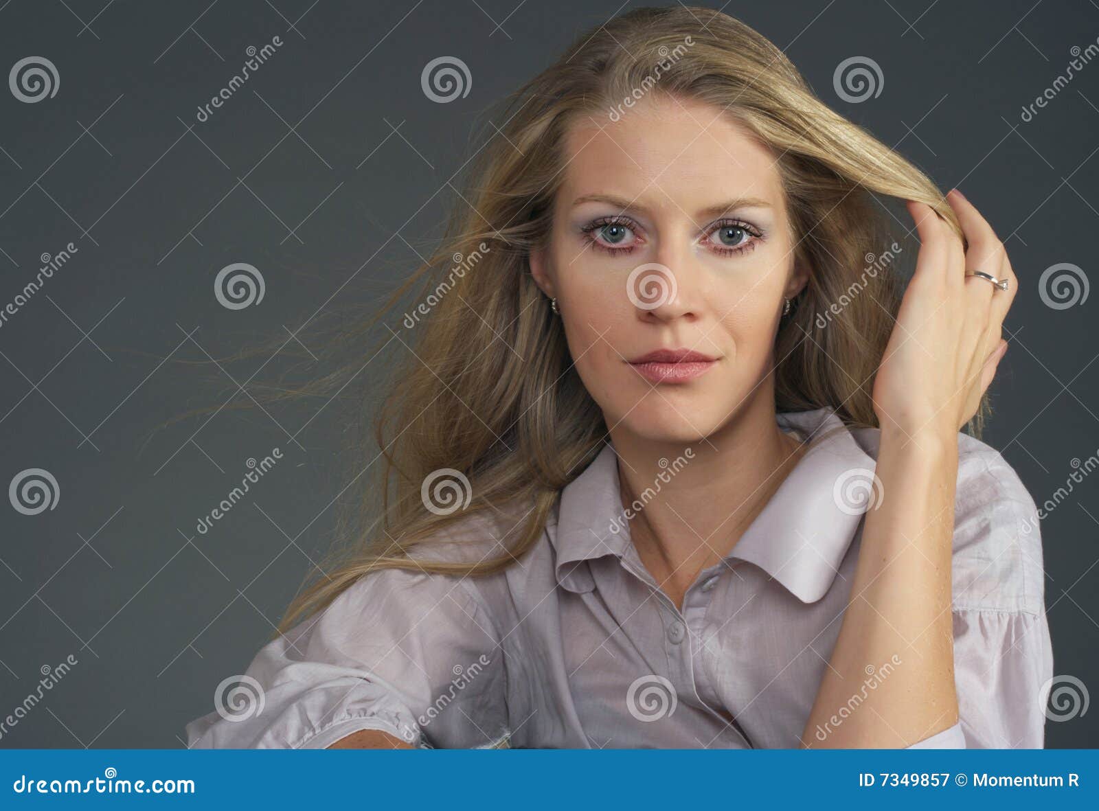 Blonde girl with wavy hair waving at the camera - wide 7