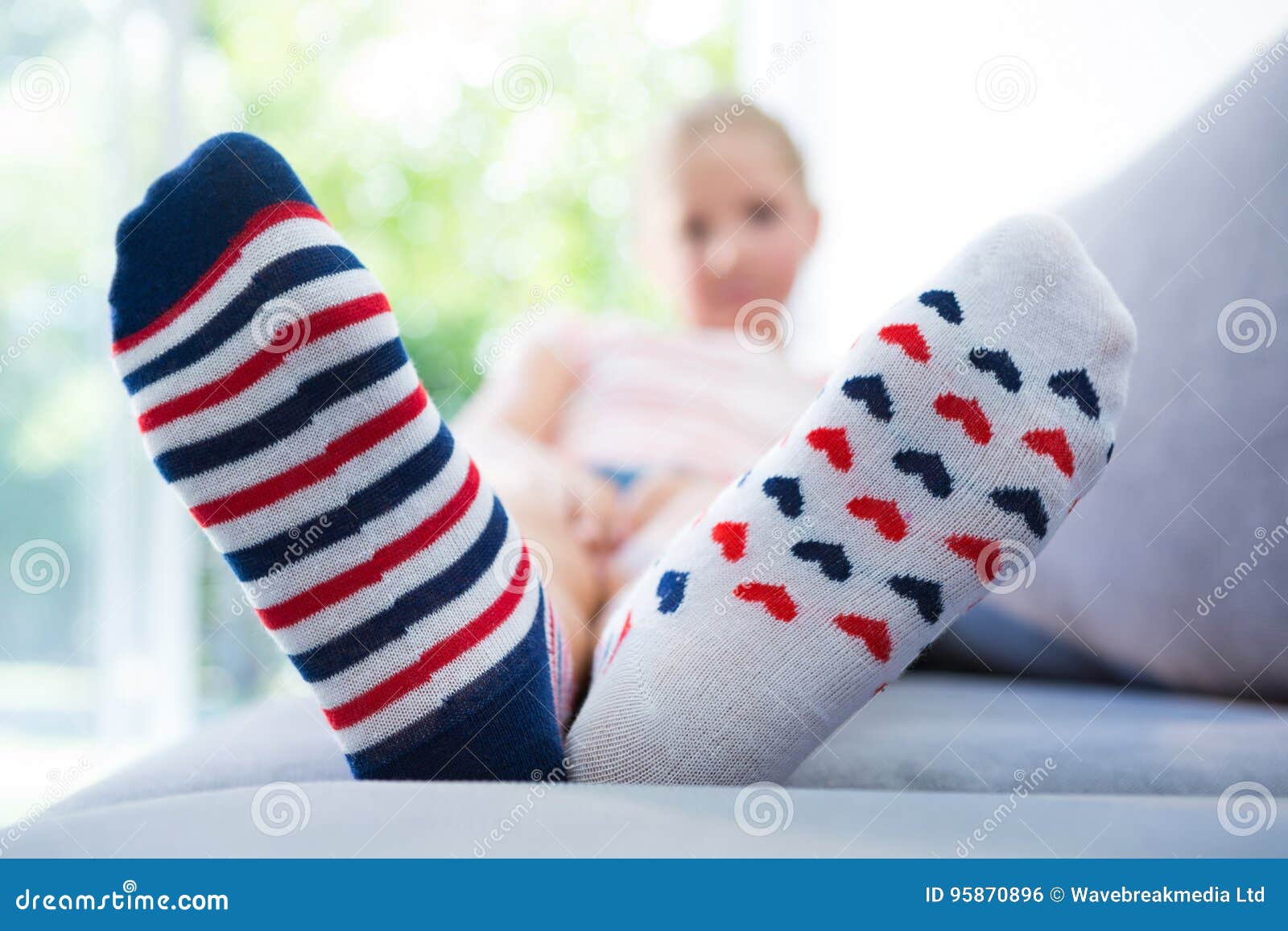 Girl Wearing Different Socks Stock Photo Image of front, blue 95870896