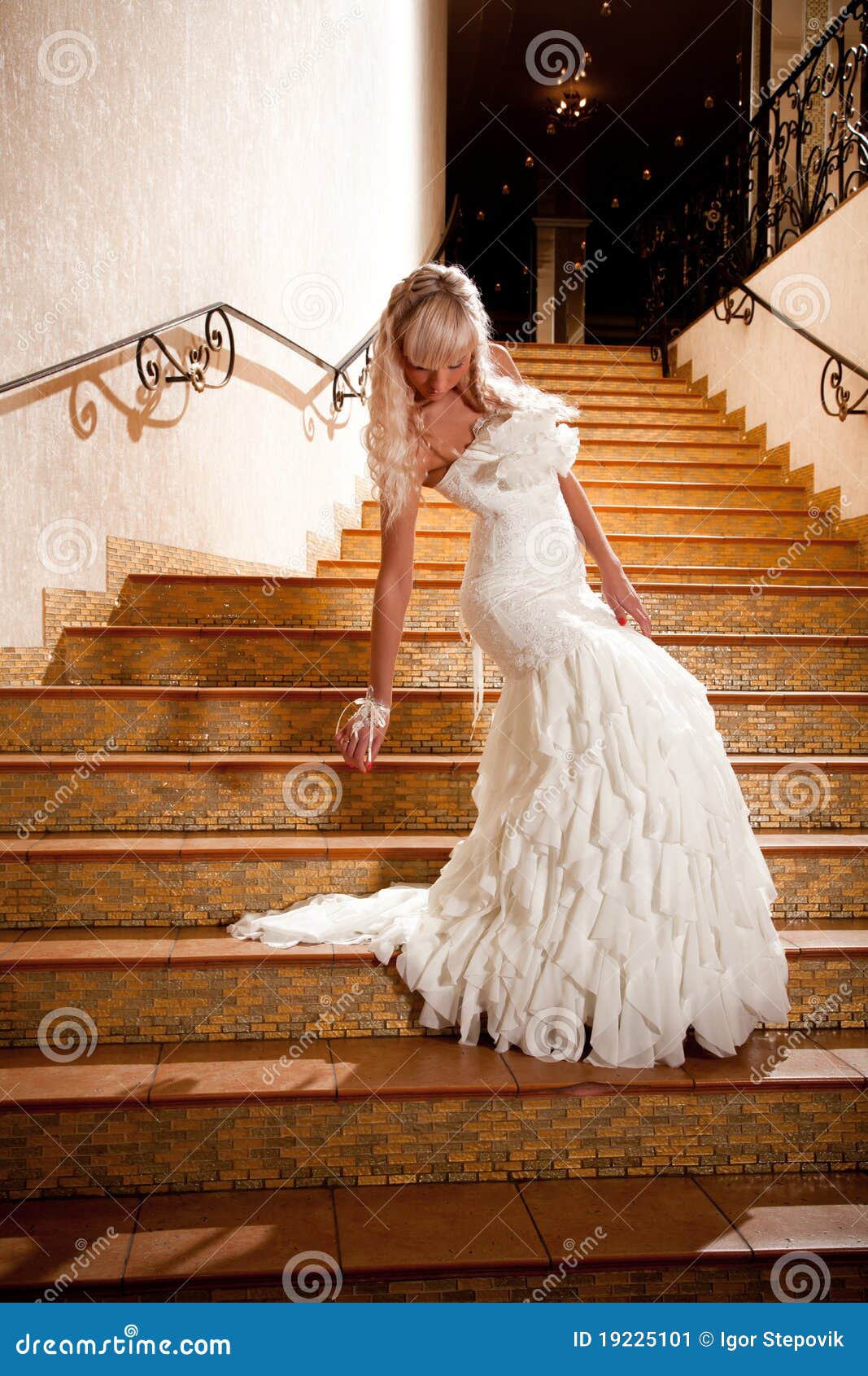 Girl In A Wedding Dress Going Down The Stairs Stock Image 