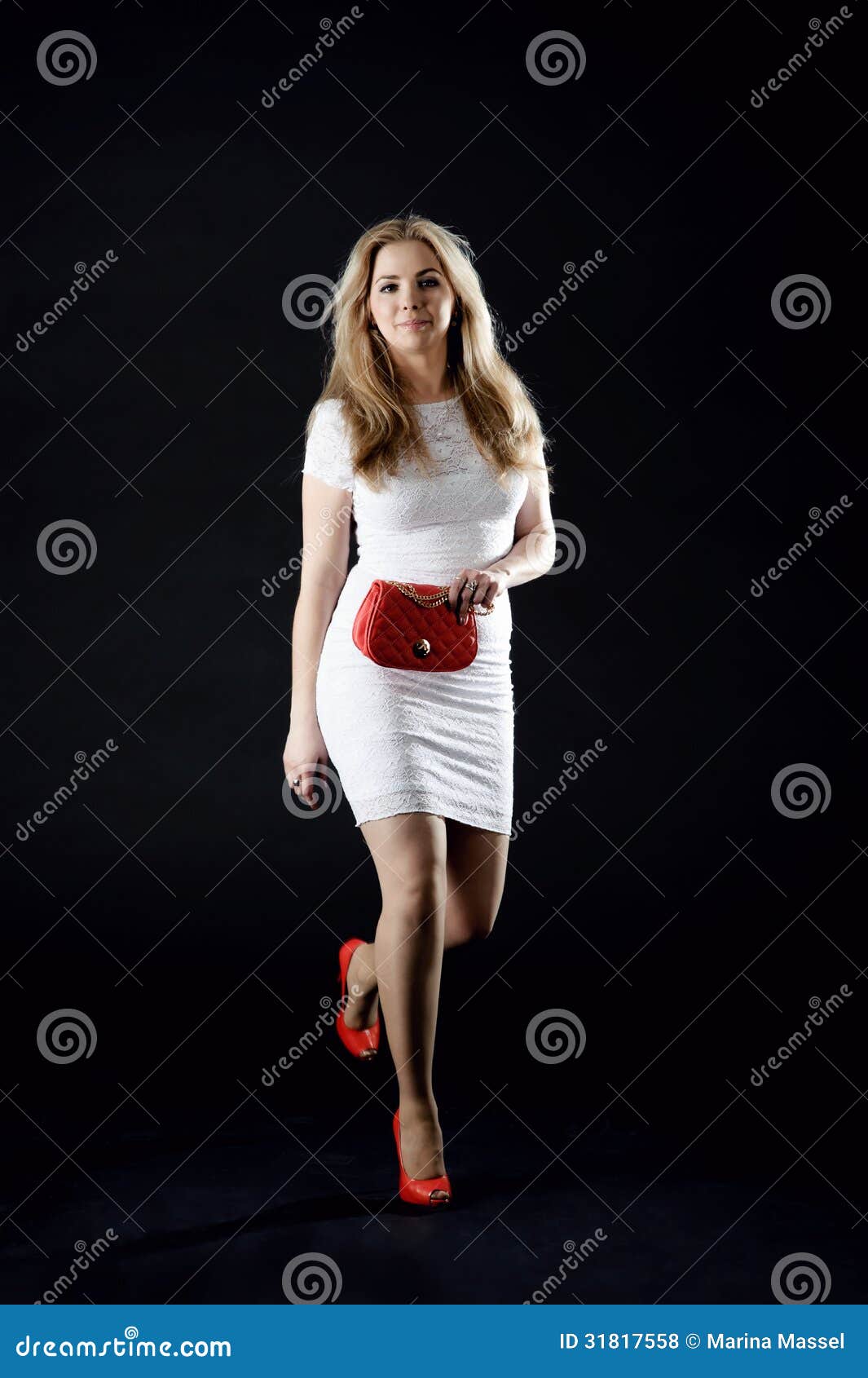 Girl In A White Dress, Red Shoes And A Red Clutch Bag 