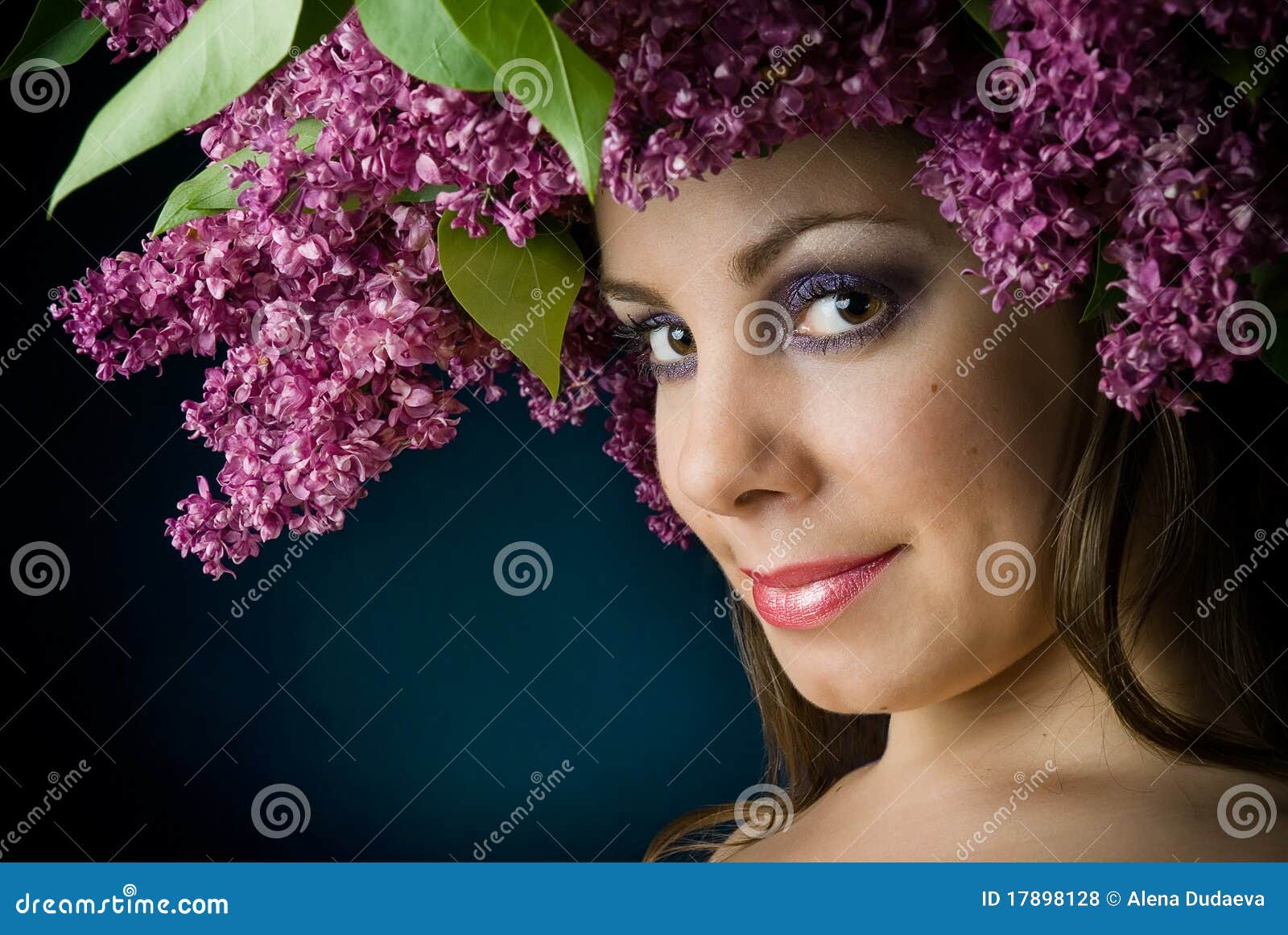 Girl with a wreath of lilac on the head