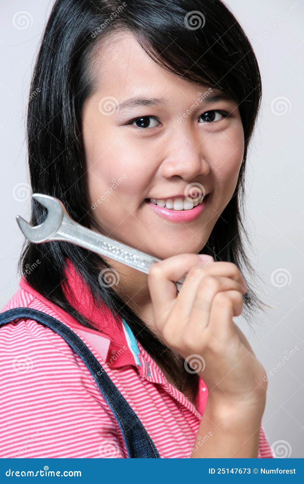 Girl and Wrench stock image. Image of asian, female, beautiful 25147673