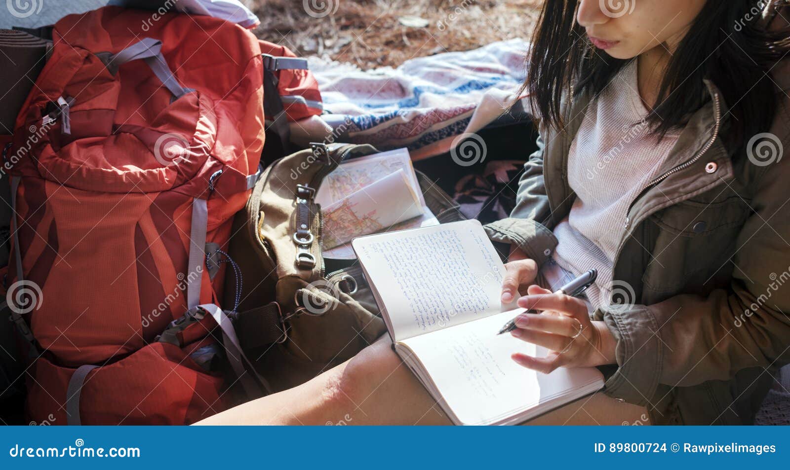 girl writing journal tent concept