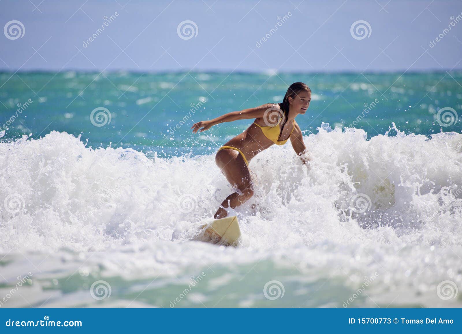 Girl in a Yellow Bikini Surfing Stock Image image image