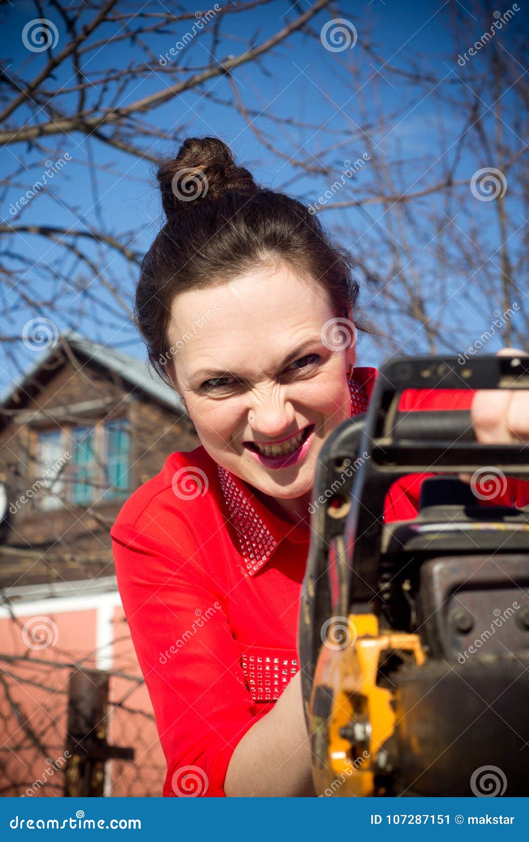 Girl with a chainsaw stock image. Image of girl, woman 107287151