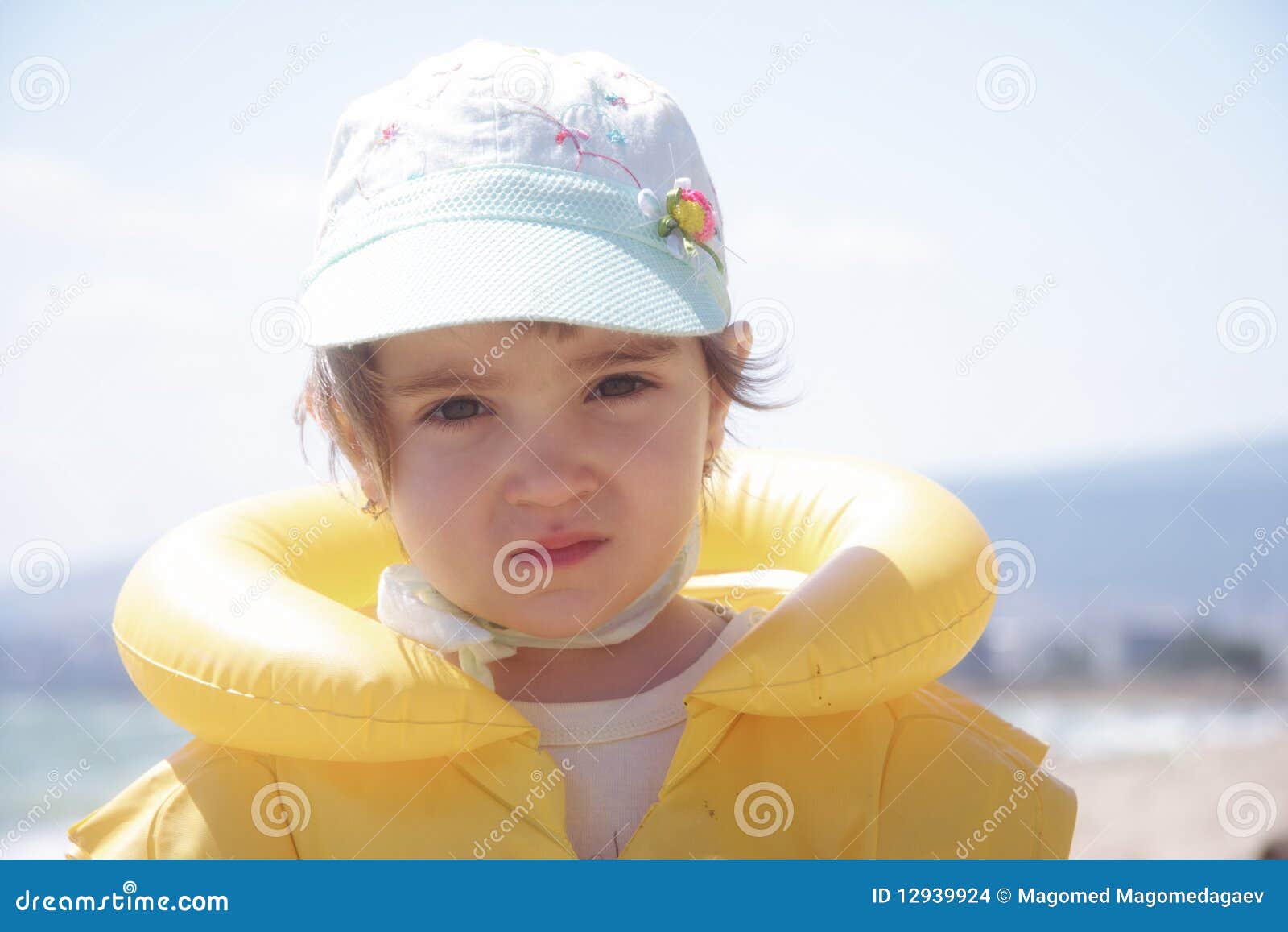 Girl in yellow life jacket stock photo. Image of jacket 12939924