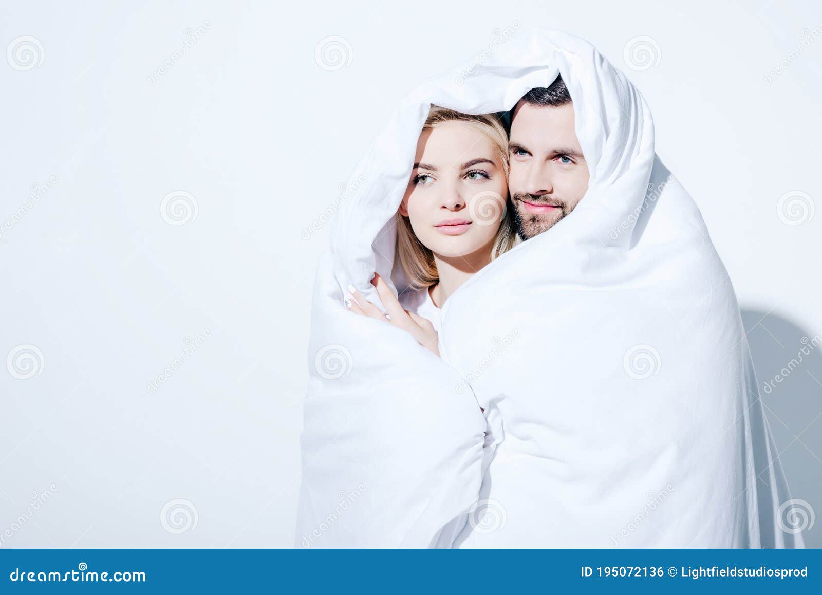 Girlfriend and Handsome Boyfriend Covered in Blanket on White Stock