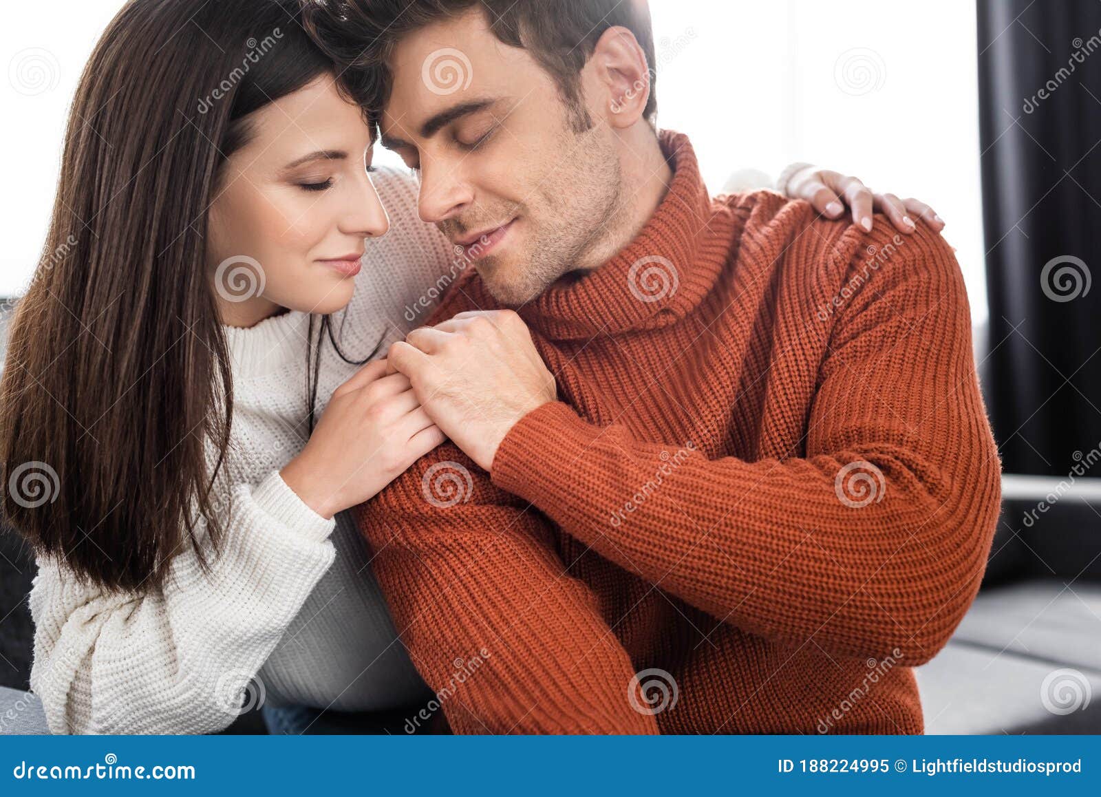 Girlfriend and Handsome Boyfriend in Sweaters Holding Hands Stock Image