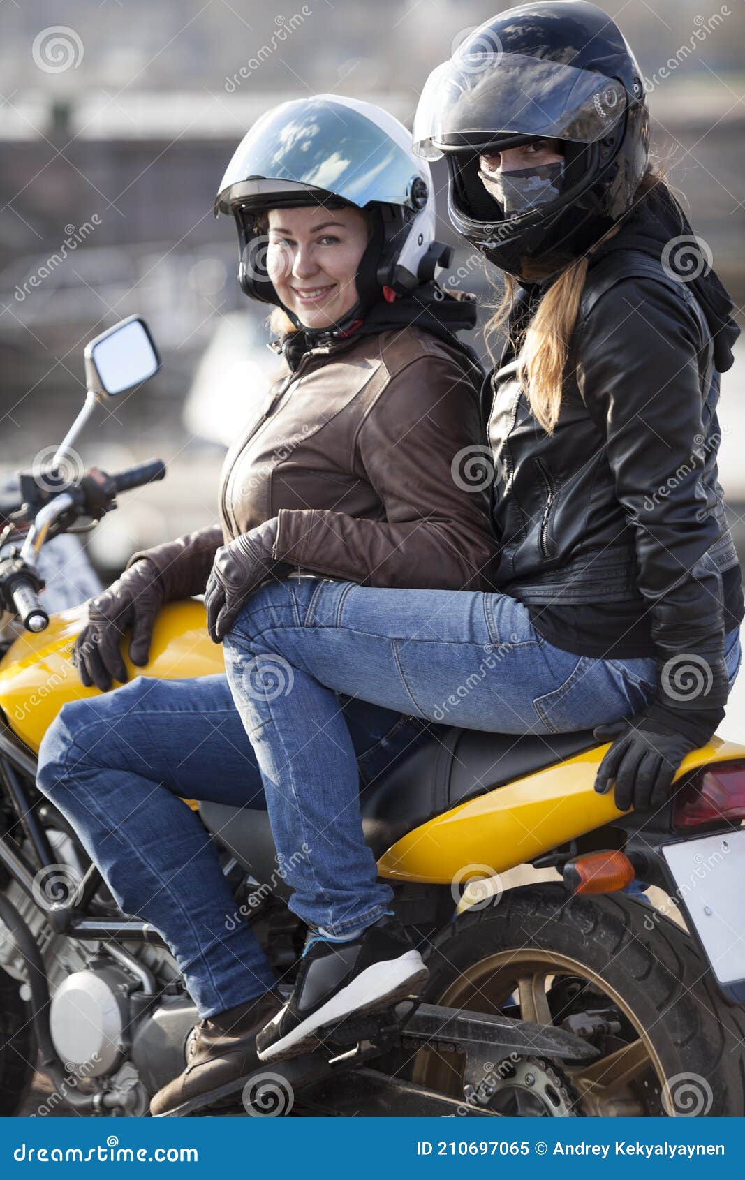 Girlfriend A Passenger Sitting Behind Female Motorcyclist
