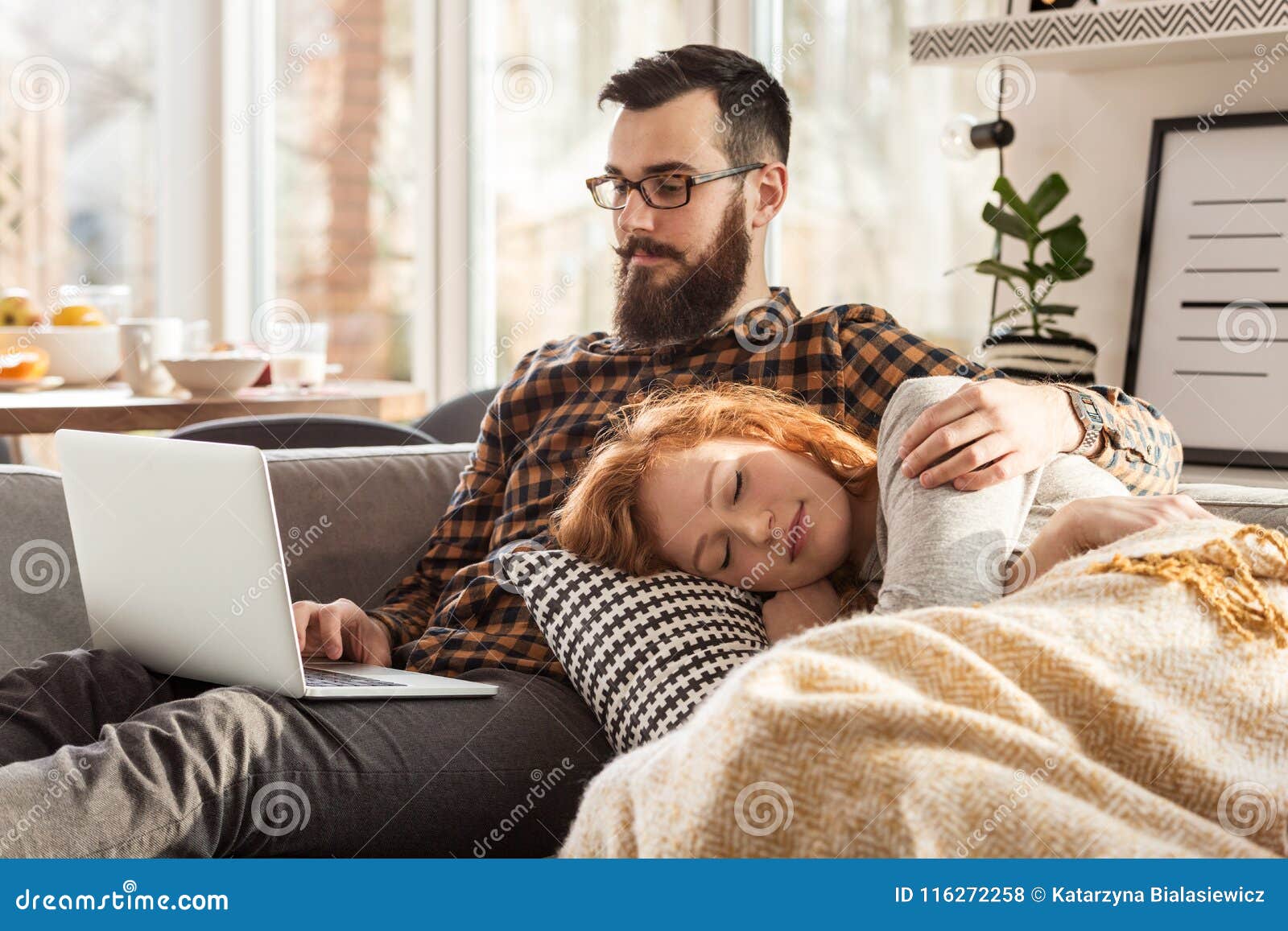 Girlfriend Sleeping on Boyfriend`s Lap Stock Photo