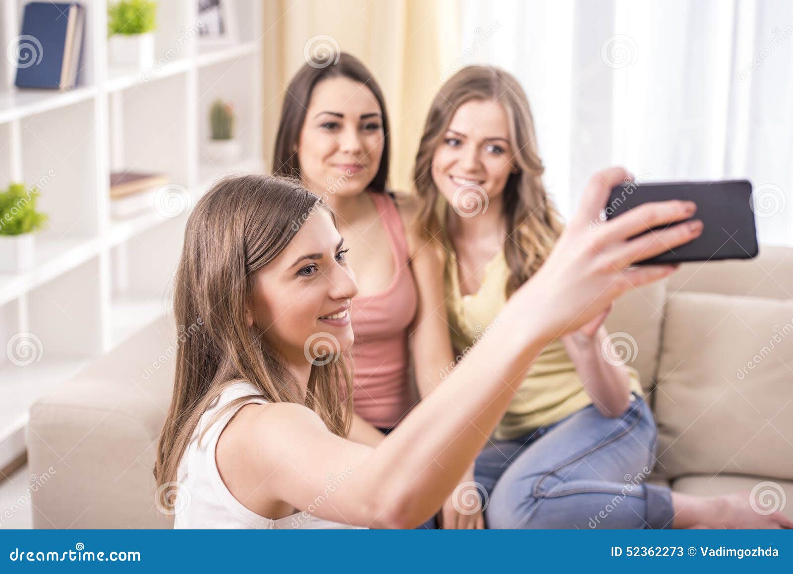 Girlfriends at home stock image. Image of phone, attractive - 52362273