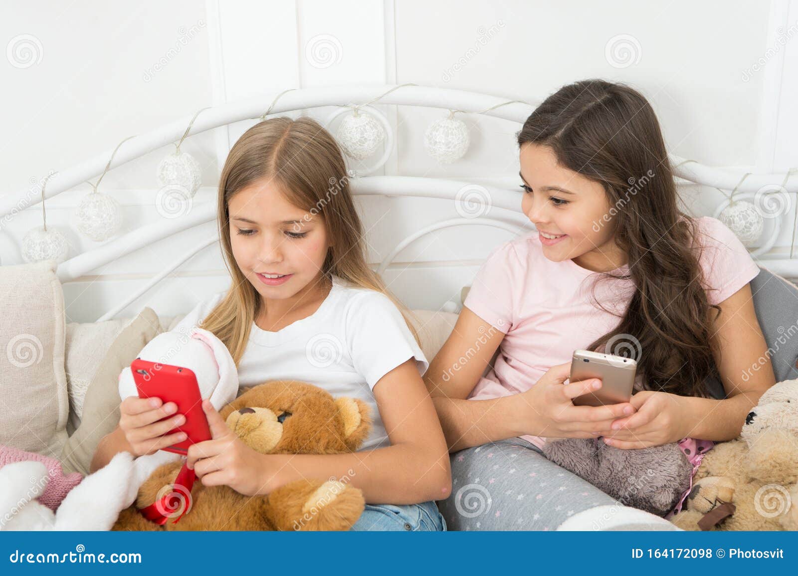 Girlish Leisure Happy Childhood. Girls with Smartphone Use Modern ...