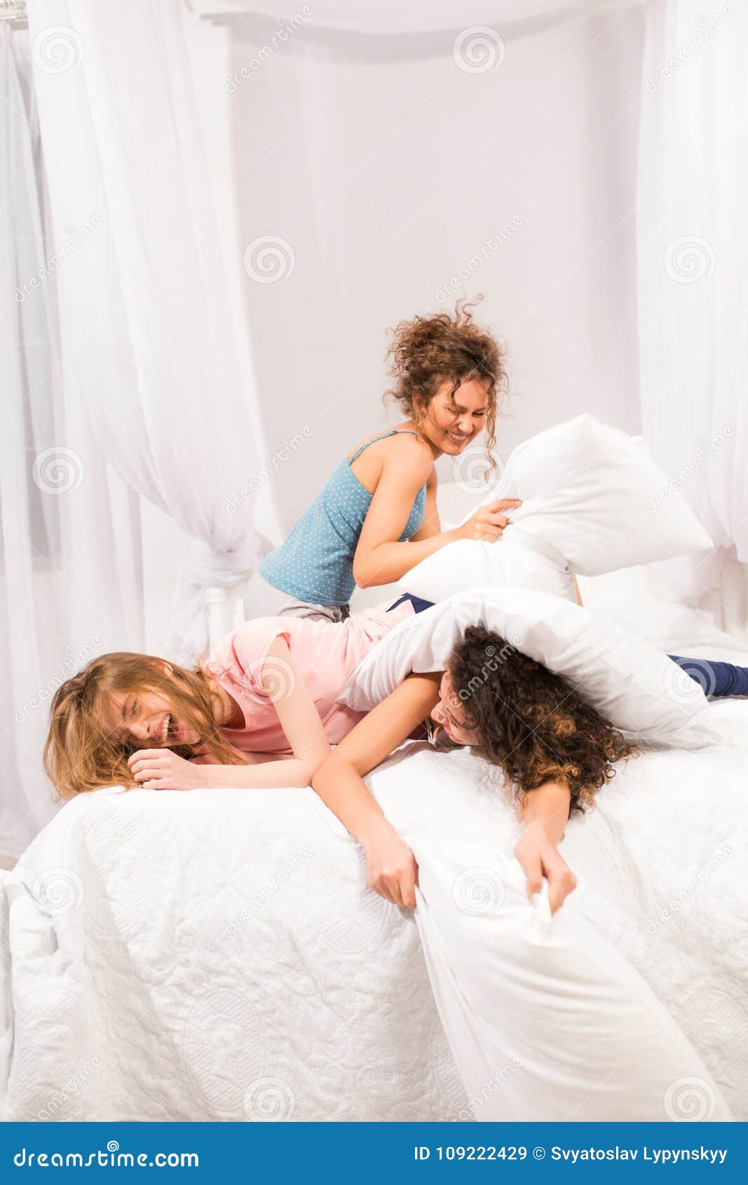 Girls In Bed Having Pillow Fight In Paj