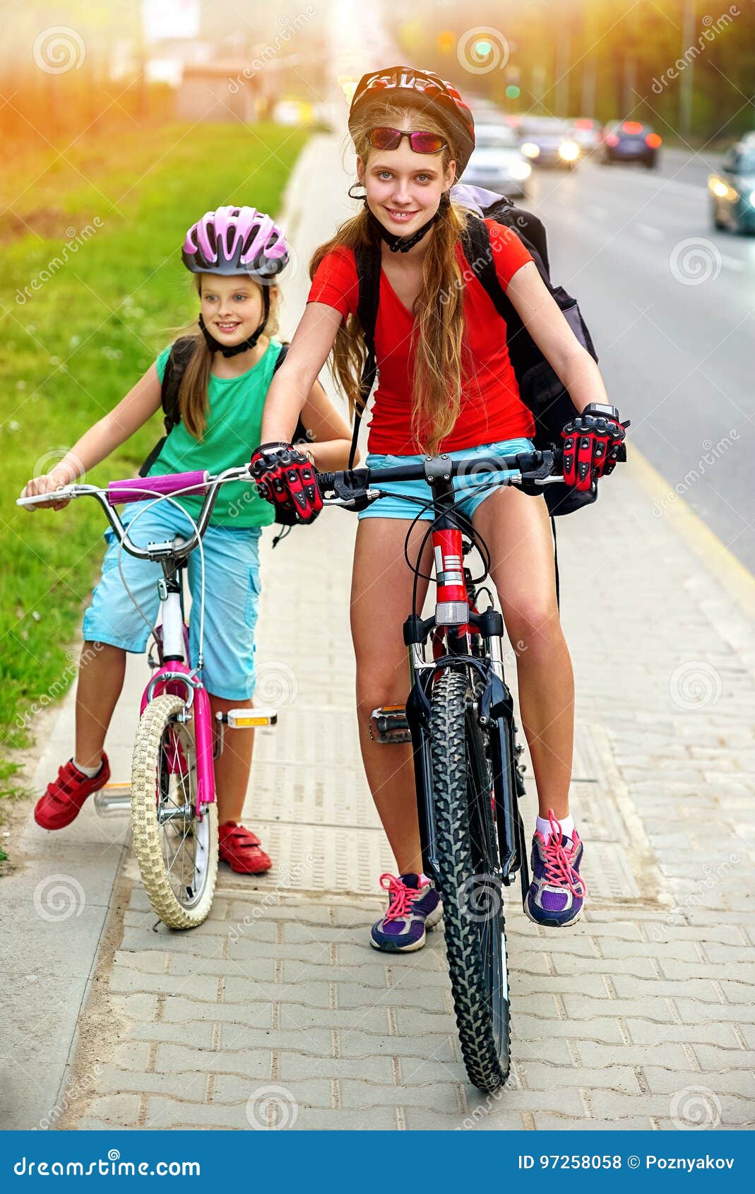 Girl Wearing Bicycle Helmet And Rucksack Ciclyng Road 
