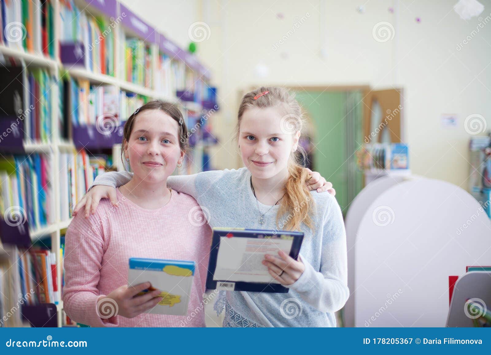 Girls Choosing Book In Library Stock Image Image Of Library Together
