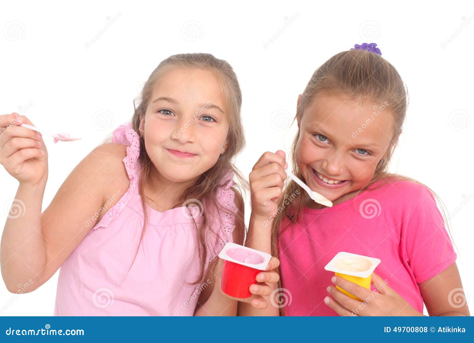 Girls eating yogurt stock photo. Image of child, smile 49700808