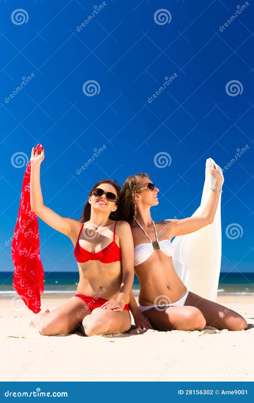 Girls Enjoying Freedom On The Beach Stock Photo - Image 