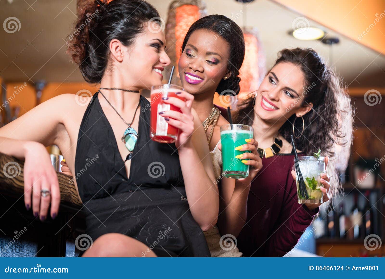 Girls Enjoying Nightlife in a Club, Drinking Cocktails Stock Photo ...