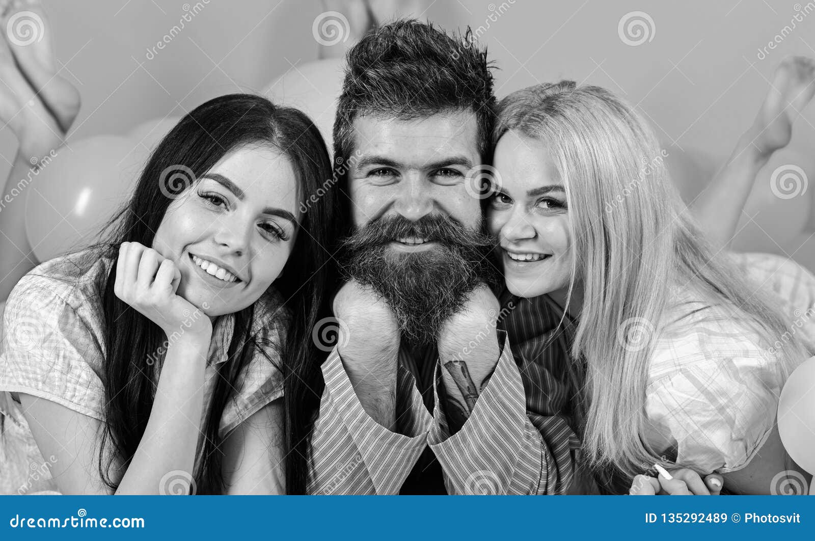 Girls Fall In Love With Bearded Macho Pink Background Threesome On Smiling Faces Lay Near