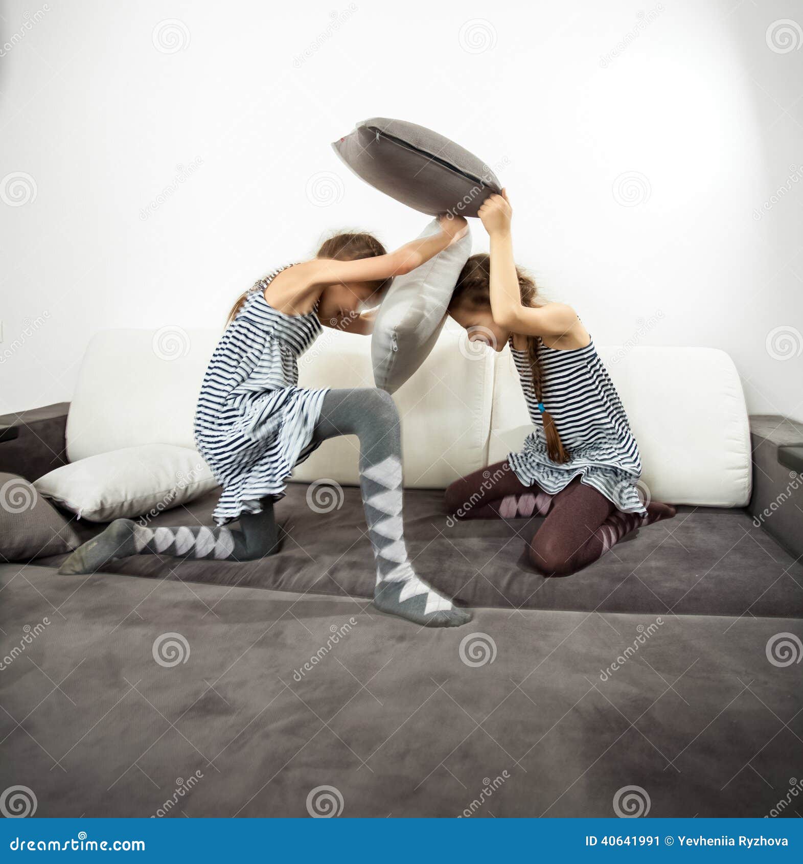 Girls Fighting with Cushions on Couch Stock Image Image of fight