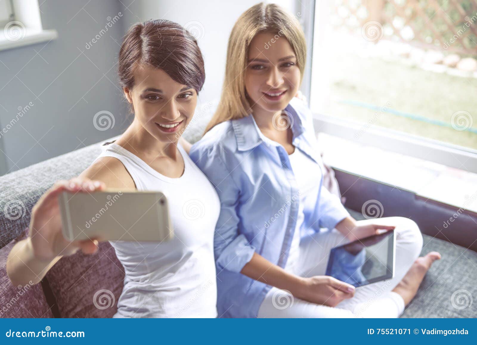 Girls with gadget stock image. Image of expression, people - 75521071