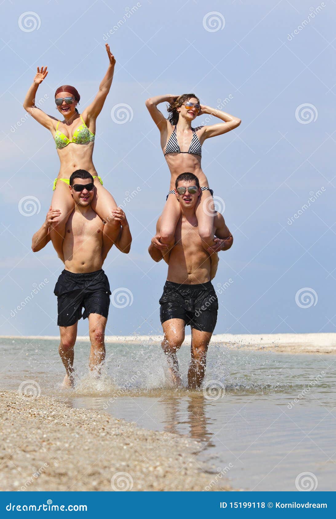 Guys are filming some girls on the beach