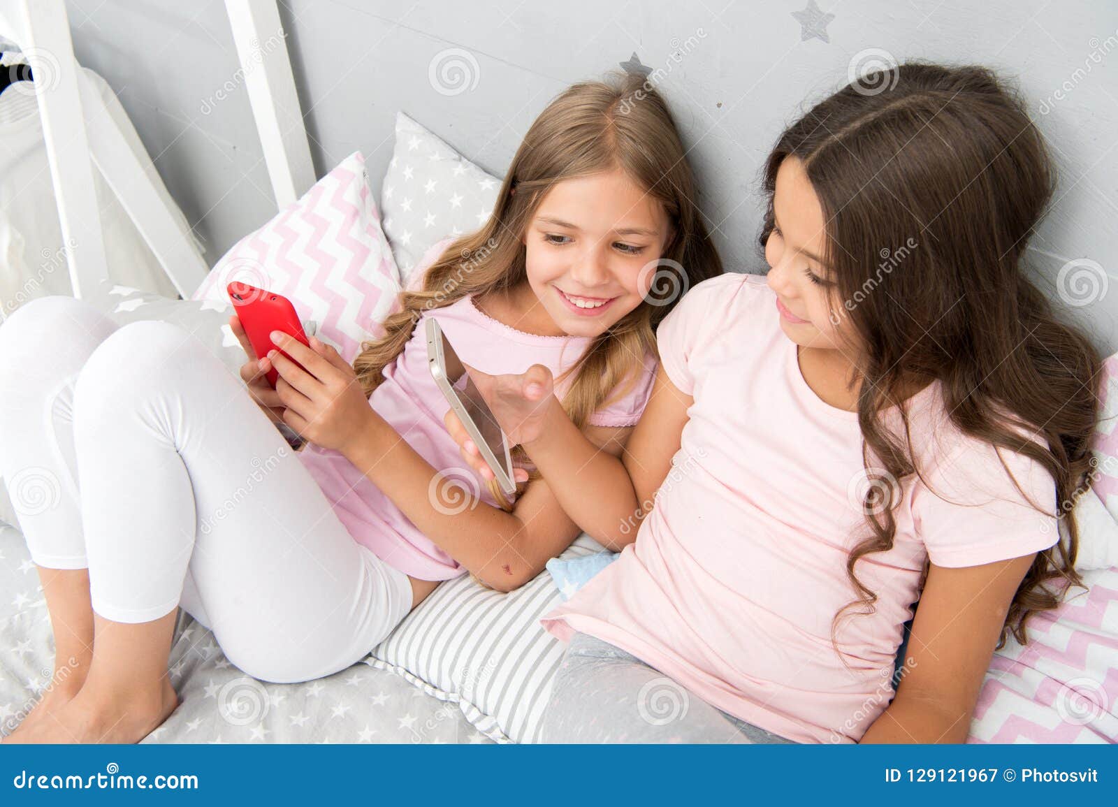 Girls Kids Best Friends or Sisters Wear Pajama Busy with Smartphones ...