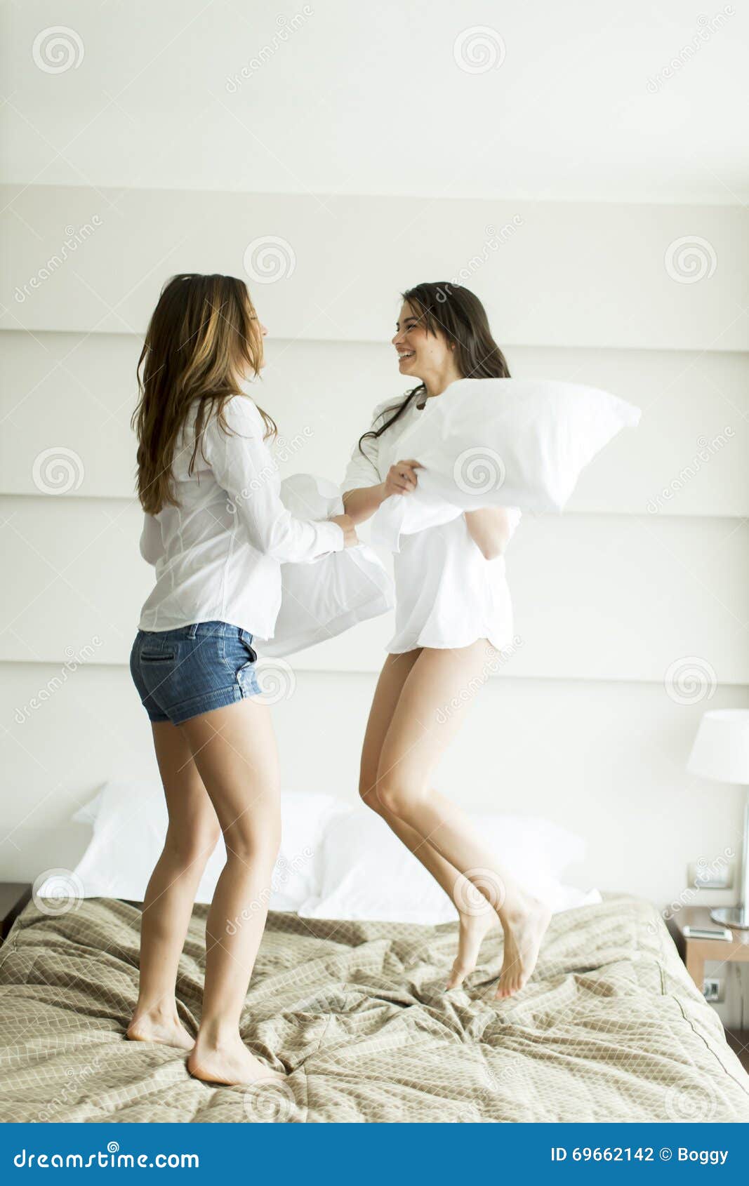 Girls in a pillow fight stock photo. Image of cheerful 69662142