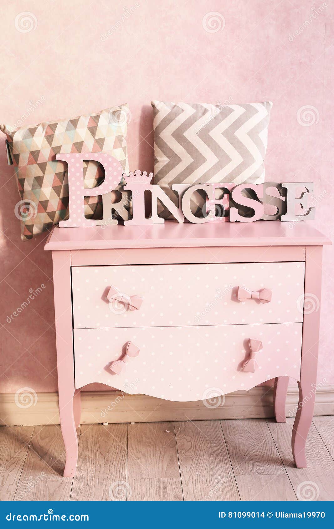 Girls Pink Chest Of Drawers Dresser With Pillows Stock Photo