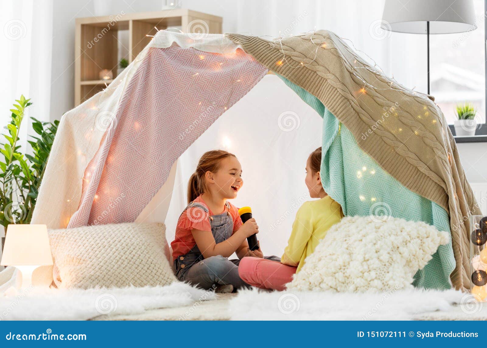 Girls Playing with Torch in Kids Tent at Home Stock Image - Image of