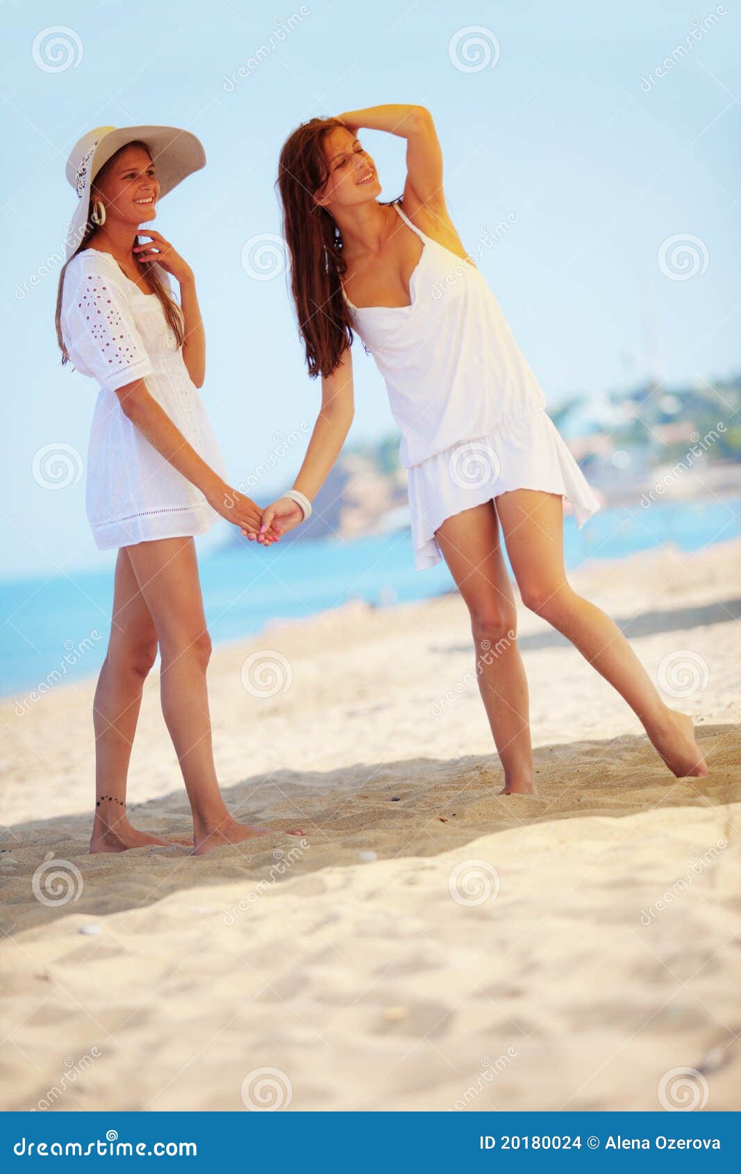 Girls resting at beach stock photo. Image of fashion - 20180024