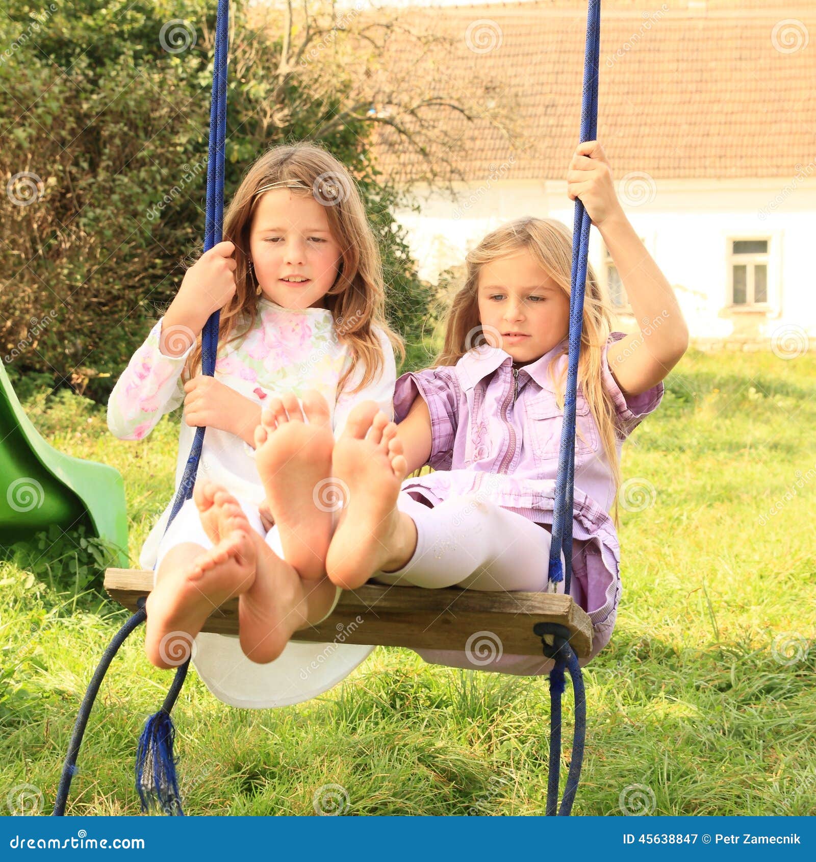 Girls swinging on swing stock image. Image of cuties - 45638847