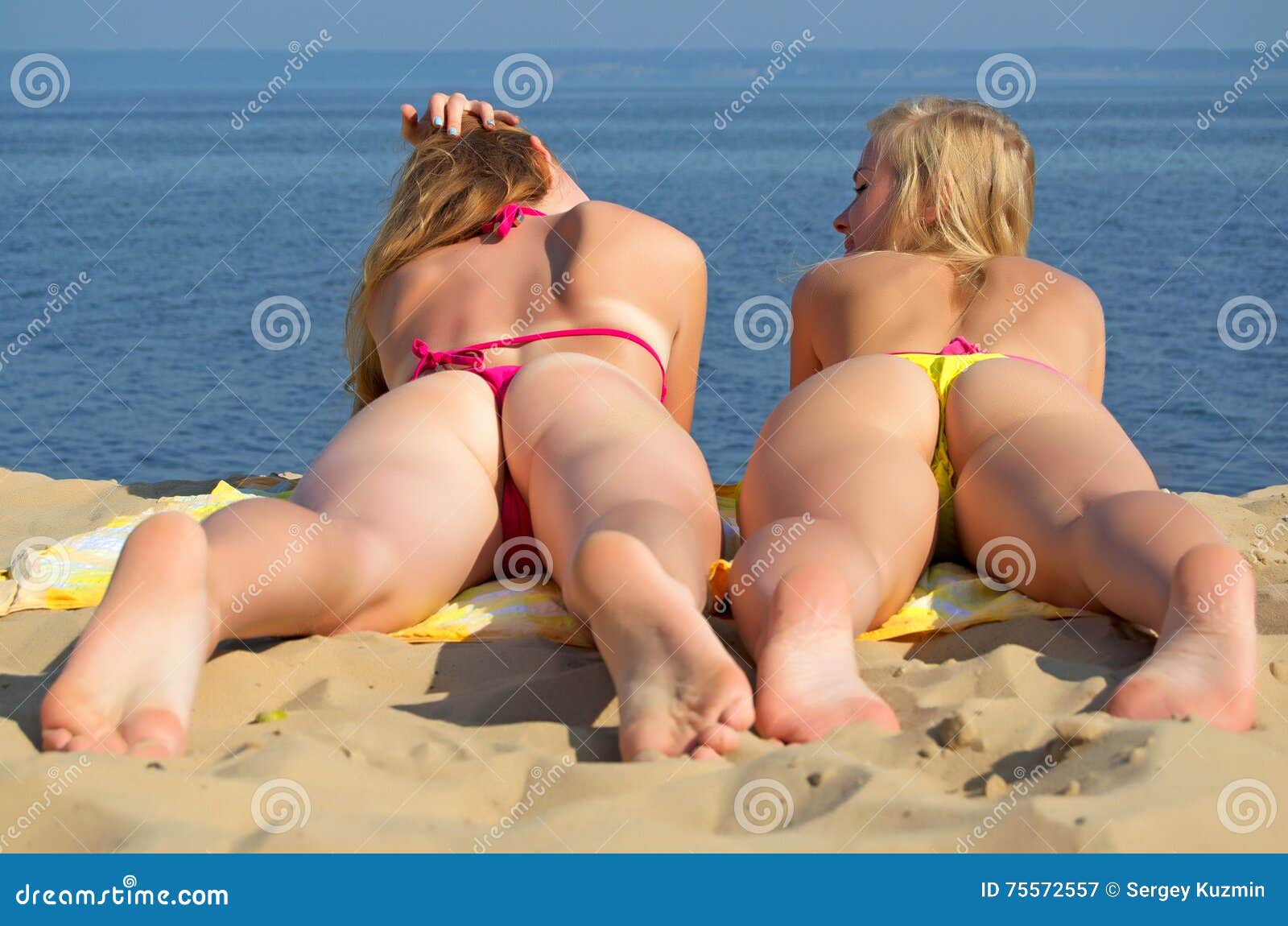 Girls in Thongs on the Beach. Stock Image - Image of beautiful