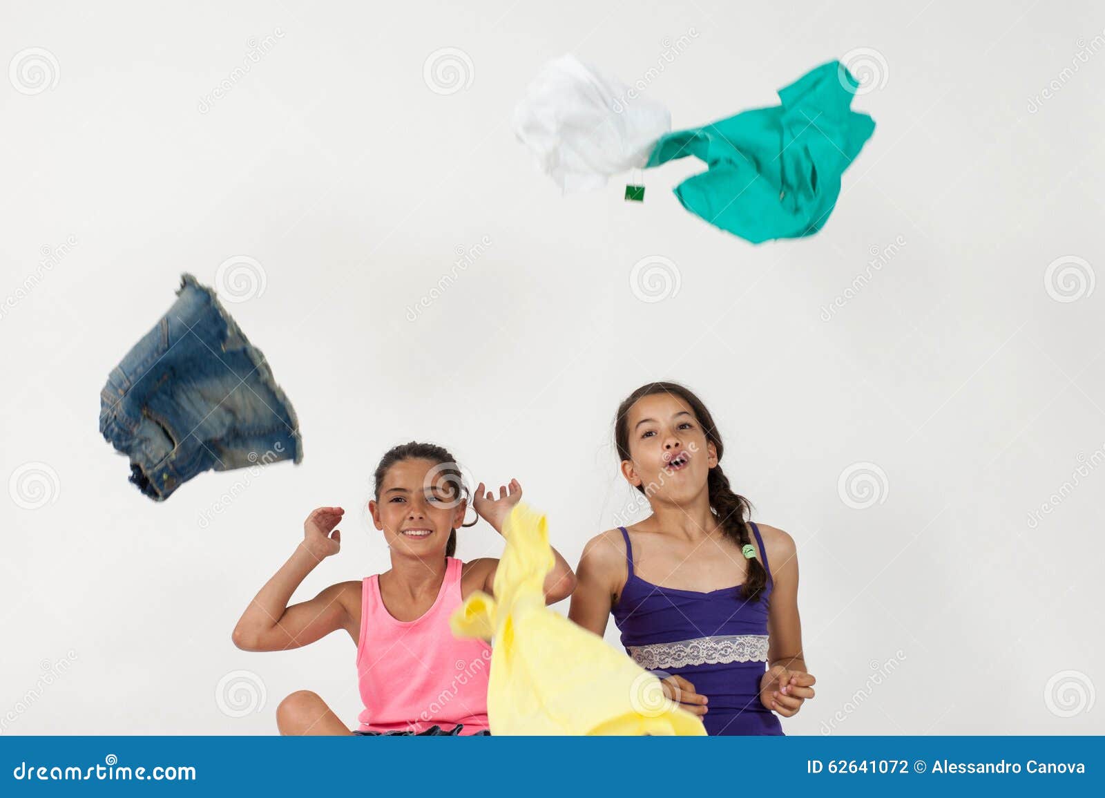 Girls Throwing Clothes in the Air Stock Photo Image of fashionable