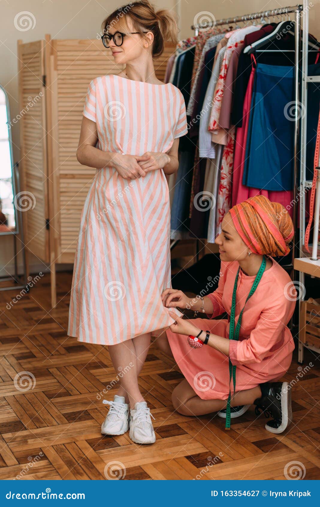 A Girl on a Seamstress Fitting Stock Image - Image of indoor