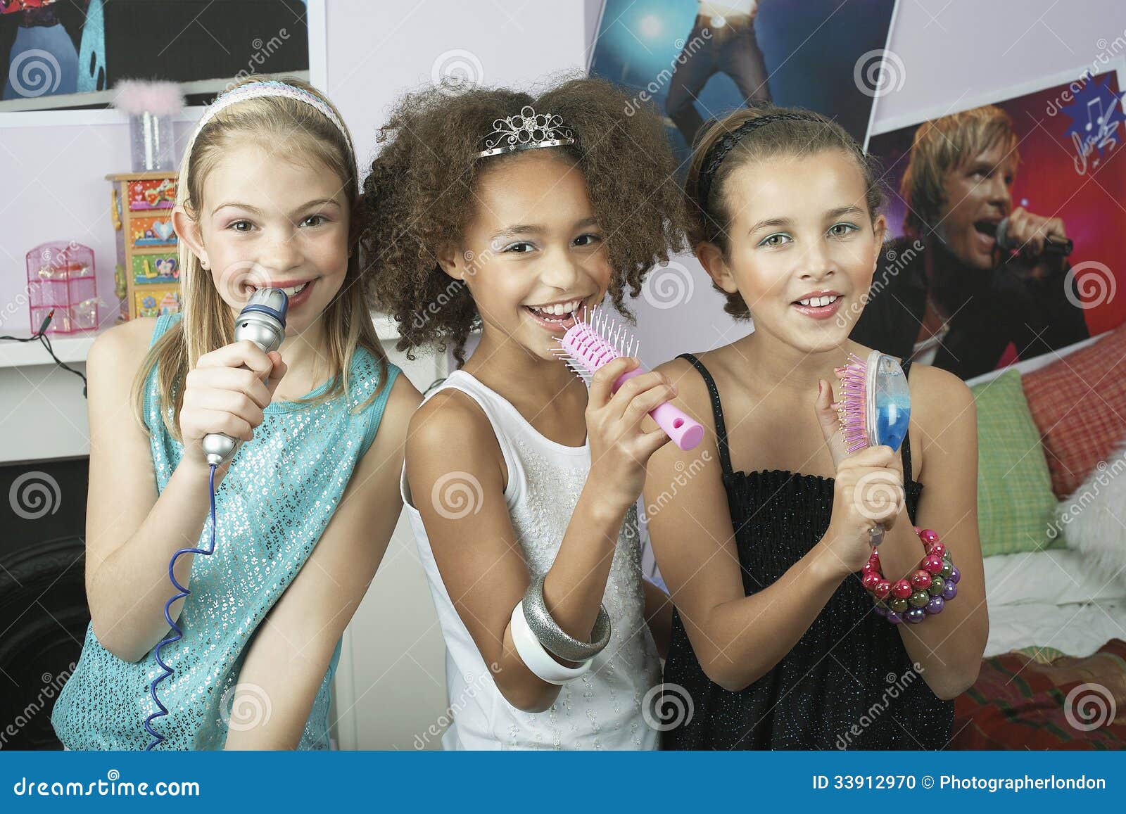 Girls Using Brushes As Microphones At Slumber Party Stock Photo Image
