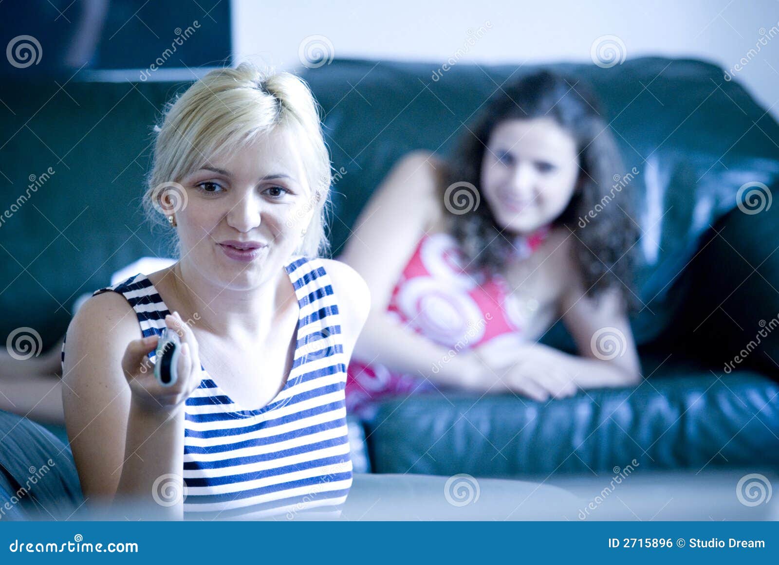 Girls watching tv stock photo. Image of woman, couch, relaxation 2715896