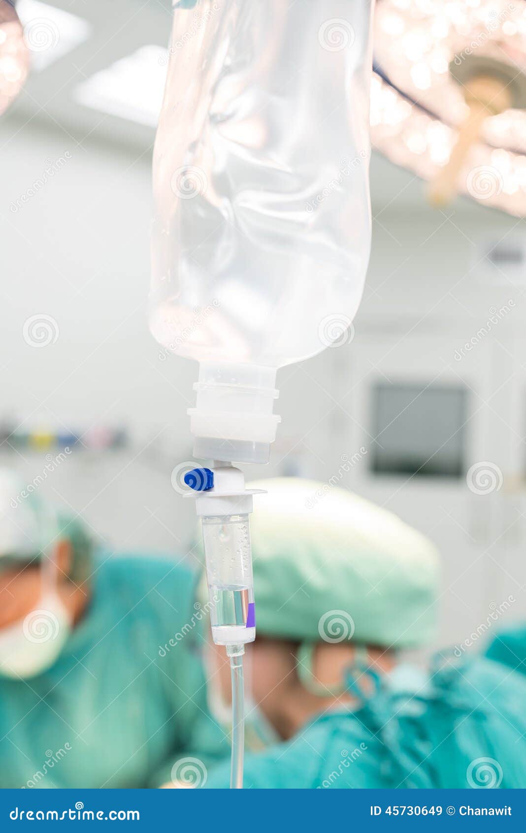 Doctor give intravenous fluid during the operation