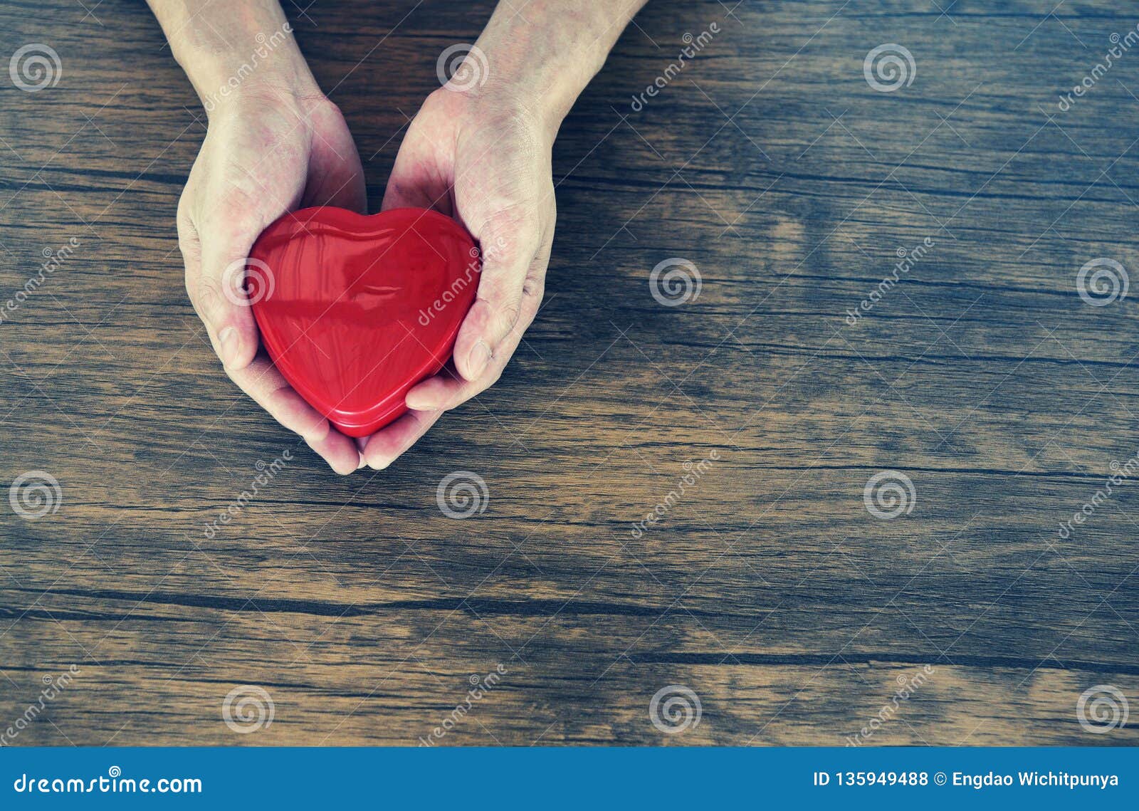 give love man holding red heart in hands for love valentines day donate help give love warmth take care concept