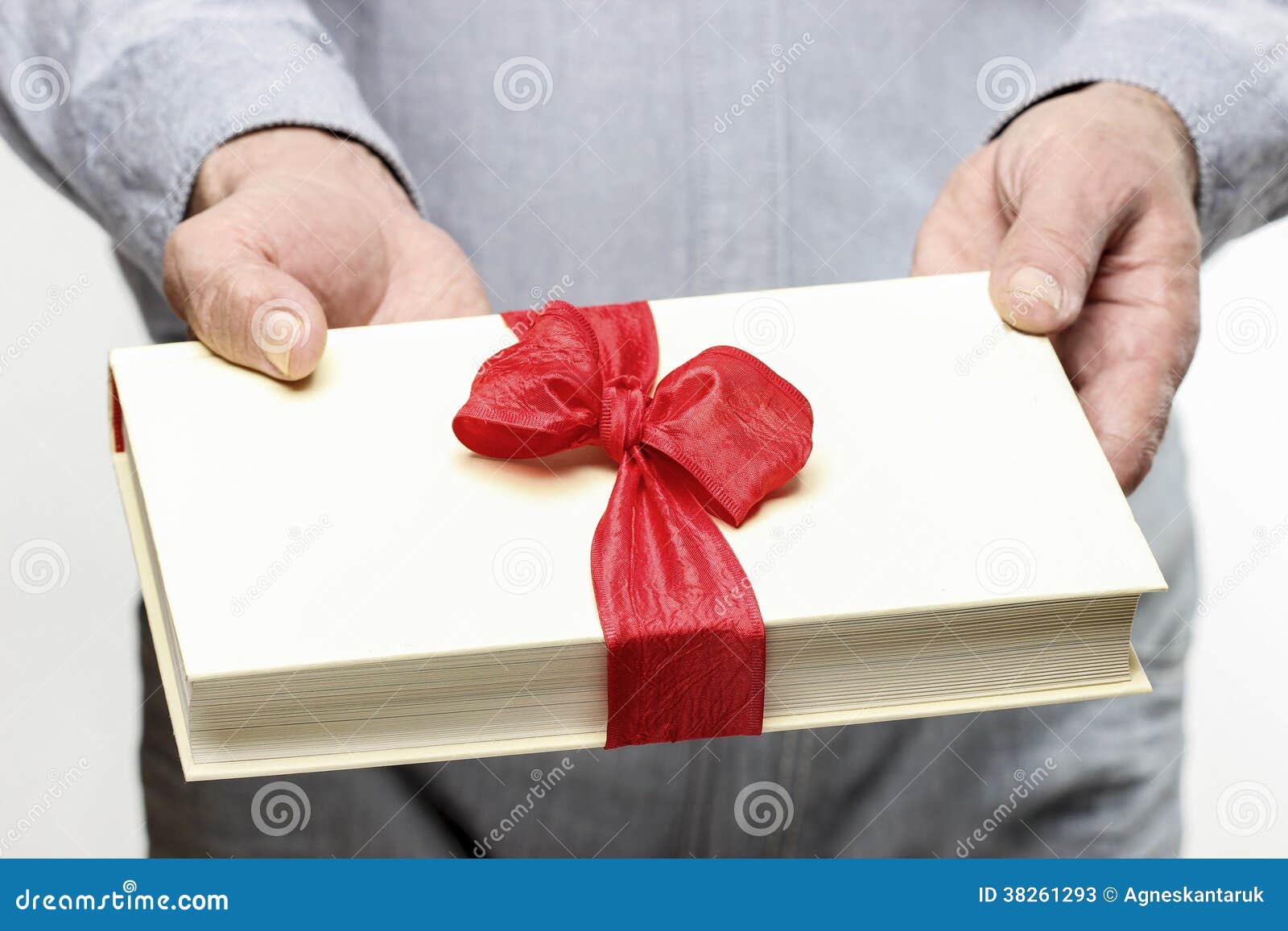 Giving book as a present stock image. Image of package 38261293