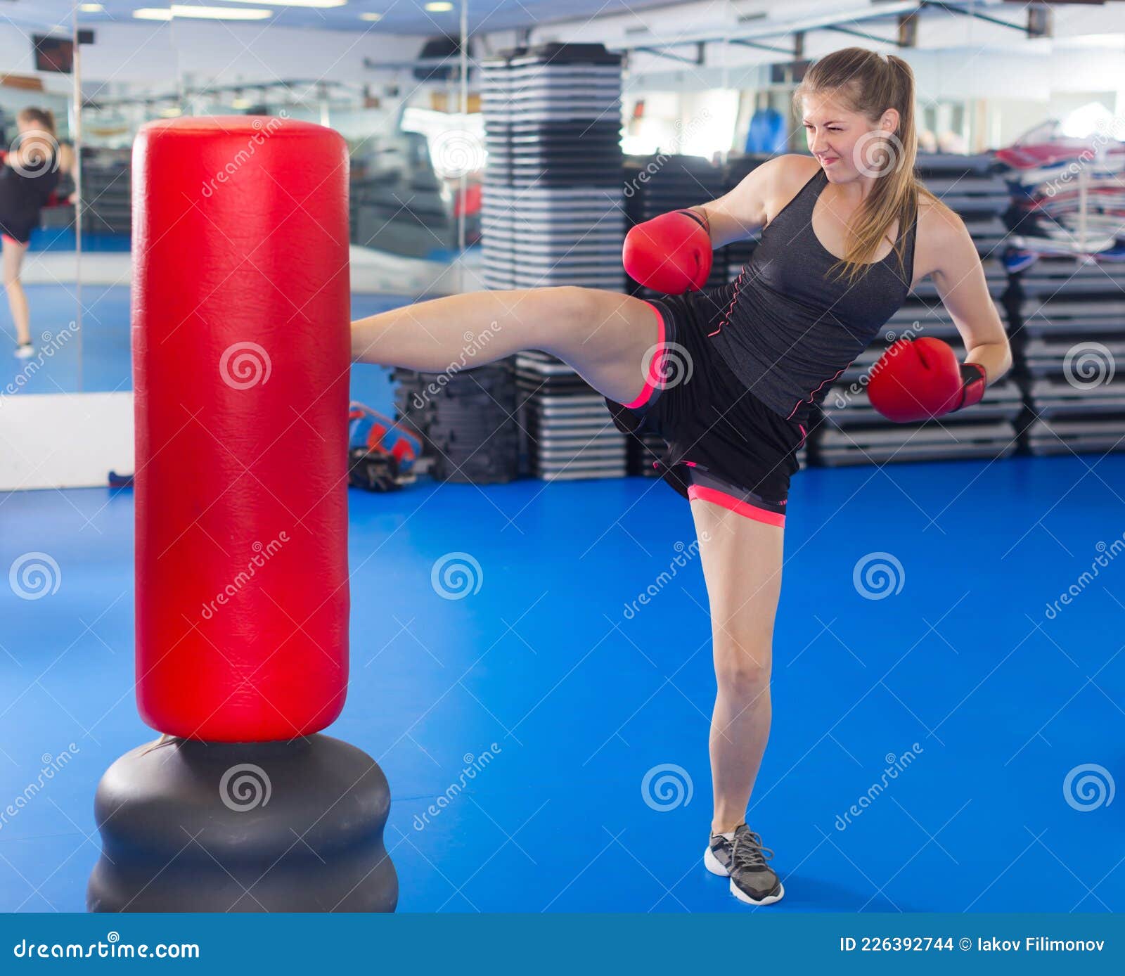 Glad Female is Doing Footkick Stock Photo Image of portrait
