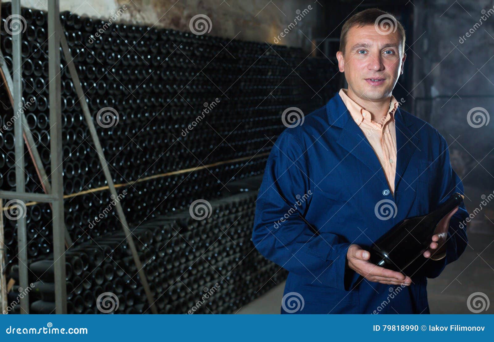 Glad Male Winery Technician Posing with Bottle Stock Photo Image of