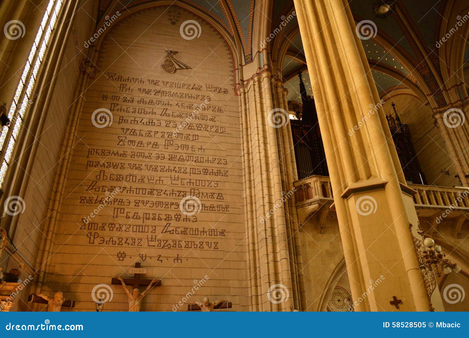 The Glagolitic alphabet, also known as Glagolitsa, is the oldest known Slavic alphabet, that was created in the 9th century by Saint Cyril. This is on the walls inside of Zagreb s cathderal. It was engraved in 1942, and it is memorial for the 1300th anniversary of the first connections between Croats and the Holy See.