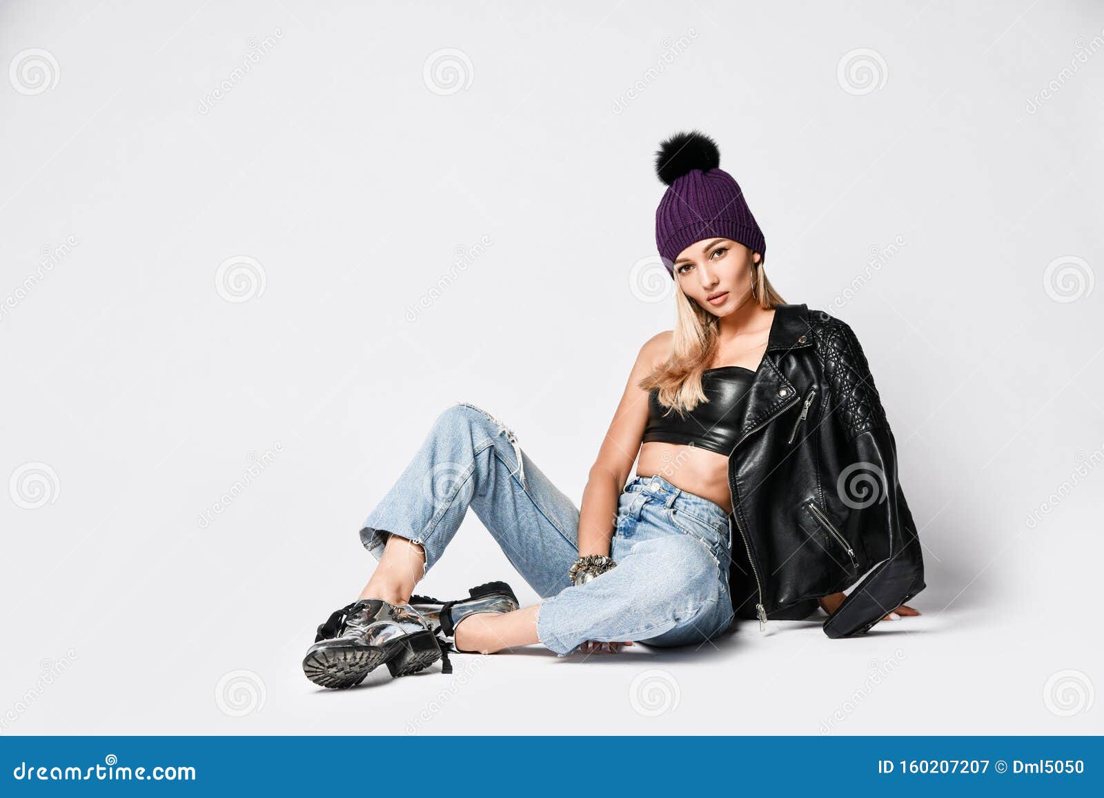 Biker Style Woman in Torn Jeans, Leather Top and Jacket, Winter Hat and  Brutal Shoes Sitting on White Looks in Camera Stock Image - Image of  frosty, leather: 160207207