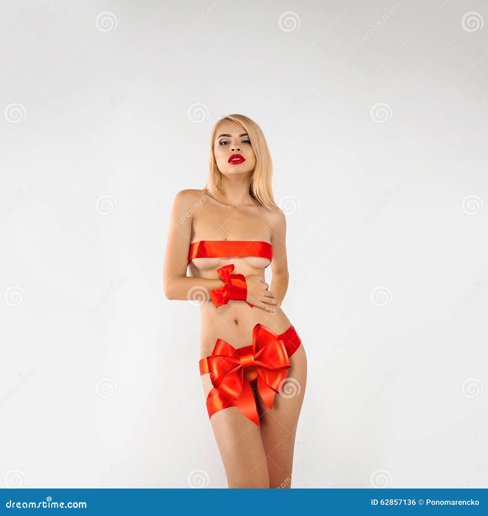 Glamour Woman-gift with Red Ribbons on Sexual Body Stock Photo