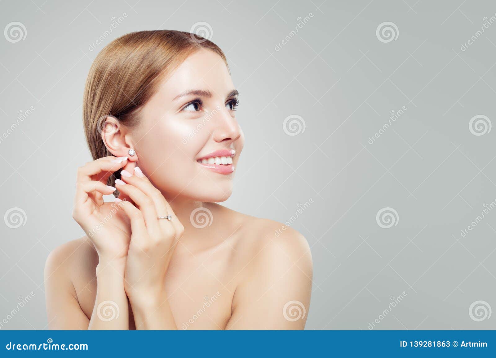 glamourous jewelry model. beautiful woman in diamond earrings and ring, fashion beauty portrait